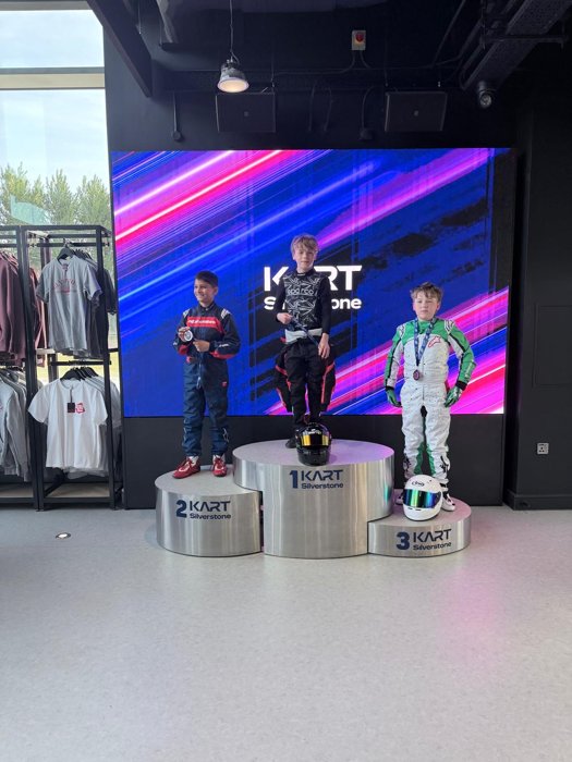 Three drivers on the podium at Kart Silverstone