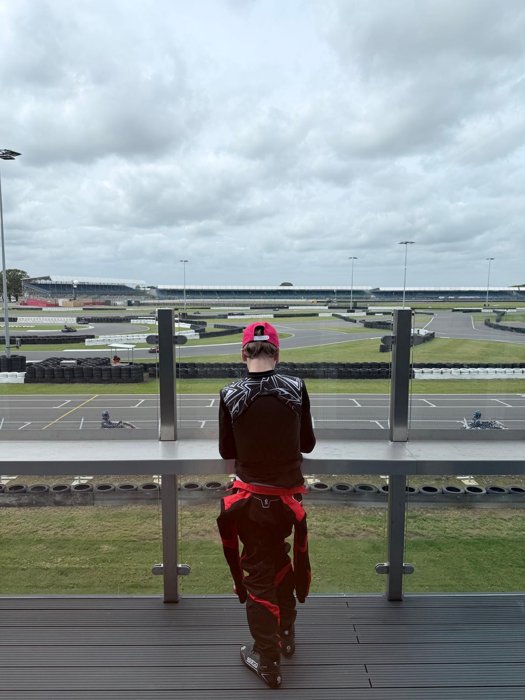 Driver looking across the karting circuit